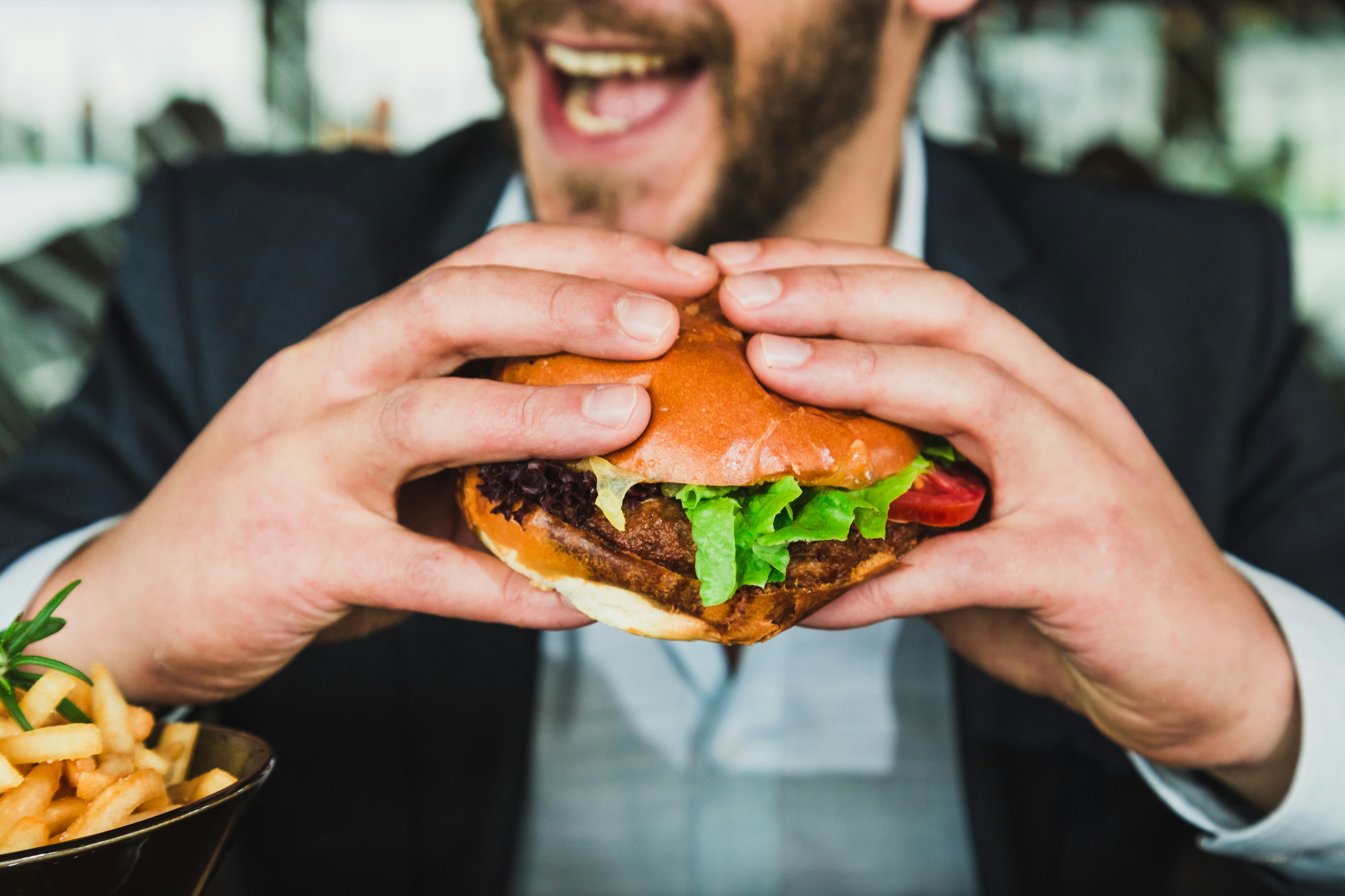 Happy Man Eating Burger